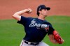 Atlanta Braves starting pitcher Kyle Wright (30) delivers in the first inning of a spring training baseball game against the Minnesota Twins Monday, March 22, 2021, in Fort Myers, Fla. (AP Photo/John Bazemore)