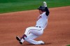 Minnesota Twins left fielder Brent Rooker (50) slides into second base with a double in the third inning of a spring training baseball game against the Boston Red Sox Sunday, March 14, 2021, in Fort Myers, Fla.. (AP Photo/John Bazemore)