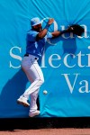 Tampa Bay Rays center fielder Manuel Margot (13) can't reach a ball hit for a triple by Boston Red Sox' Francy Cordero in the fourth inning of a spring training baseball game Friday, March 26, 2021, in Port Charlotte, Fla. (AP Photo/John Bazemore)