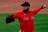 Boston Red Sox starting pitcher Eduardo RodrÃ­guez (57) works against the Minnesota Twins in the second inning of a spring training baseball game, Thursday, March 11, 2021, in Fort Myers, Fla.. (AP Photo/John Bazemore)