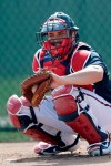 Newly acquired Atlanta Braves catcher Travis D'Arnaud works during spring training baseball camp Thursday, Feb. 13, 2020, in North Port, Fla. (AP Photo/John Bazemore)