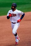 Minnesota Twins center fielder Byron Buxton (25) rounds the bases after hitting a solo home run in the third inning of a spring training baseball game Boston Red Sox Sunday, March 14, 2021, in Fort Myers, Fla.. (AP Photo/John Bazemore)
