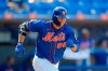 New York Mets' Tim Tebow runs out a ground out against the St. Louis Cardinals during the eighth inning of a spring training baseball game, Wednesday, March 4, 2020, in Port St. Lucie, Fla. (AP Photo/Julio Cortez)