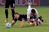 Montreal Impact's Samuel Piette, lower left, and D.C. United midfielder Ulises Segura, right, fall going for the ball during the first half of an MLS soccer match, Tuesday, July 21, 2020, in Kissimmee, Fla. (AP Photo/John Raoux)