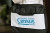 A briefcase of a census taker is seen as she knocks on the door of a residence Tuesday, Aug. 11, 2020, in Winter Park, Fla. A half-million census takers head out en mass this week to knock on the doors of households that haven't yet responded to the 2020 census. (AP Photo/John Raoux)