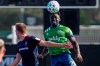 Chicago Fire forward Robert Beric, left, battles with Seattle Sounders defender Yeimar Gomez for possession of the ball during the first half of an MLS soccer match, Tuesday, July 14, 2020, in Kissimmee, Fla. (AP Photo/John Raoux)