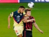 Club America defender Sebastian Caceres, left, and Atlanta United midfielder Jackson Conway go up for a header to control the ball during the second half of a CONCACAF Champions League soccer match, Wednesday, Dec. 16, 2020, in Orlando, Fla. (AP Photo/John Raoux)