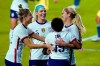 U.S. midfielder Lindsey Horan, right, is congratulated, after scoring a goal against Colombia, by midfielder Kristie Mewis, left, midfielder Julie Ertz, center, and defender Crystal Dunn, second from right, during the second half of an international friendly soccer match Friday, Jan. 22, 2021, in Orlando, Fla. (AP Photo/John Raoux)