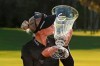 Madelene Sagstrom kisses her trophy after winning the Gainbridge LPGA golf tournament at Boca Rio, Sunday, Jan. 26, 2020, in Boca Raton, Fla. (John McCall/South Florida Sun-Sentinel via AP)