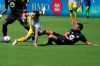 Columbus Crew midfielder Lucas Zelarayan, left, falls to the field as he goes for the ball against CF Montréal defender Rudy Camacho during the first half of an MLS soccer match, Saturday, May 1, 2021, in Fort Lauderdale, Fla. (AP Photo/Lynne Sladky)