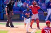 New York Mets' Luis Guillorme, center, draws a walk off St. Louis Cardinals relief pitcher Jordan Hicks during the fifth inning of a spring training baseball game, Sunday, March 14, 2021, in Port St. Lucie, Fla. (AP Photo/Lynne Sladky)