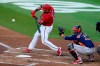Washington Nationals' Alex Avila (6) hits a RBI single to score Kyle Schwarber during the first inning of a spring training baseball game against the Houston Astros, Wednesday, March 24, 2021, in West Palm Beach, Fla. At right is Houston Astros catcher Martin Maldonado. (AP Photo/Lynne Sladky)