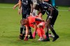 Inter Miami goalkeeper Luis Robles, left, is helped up off the pitch by New York City FC defender Sebastien Ibeagha after he collided with a NYCFC player during the second half of an MLS soccer match, Saturday, Oct. 3, 2020, in Fort Lauderdale, Fla. (AP Photo/Lynne Sladky)