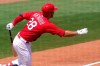 St. Louis Cardinals' Nolan Arenado (28) follows through on a single during the fourth inning of a spring training baseball game against the Washington Nationals, Monday, March 15, 2021, in Jupiter, Fla. (AP Photo/Lynne Sladky)