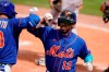 New York Mets' Francisco Lindor (12) is congratulated by Michael Conforto after scoring on a solo home run during the fifth inning of a spring training baseball game Miami Marlins, Tuesday, March 23, 2021, in Port St. Lucie, Fla. (AP Photo/Lynne Sladky)