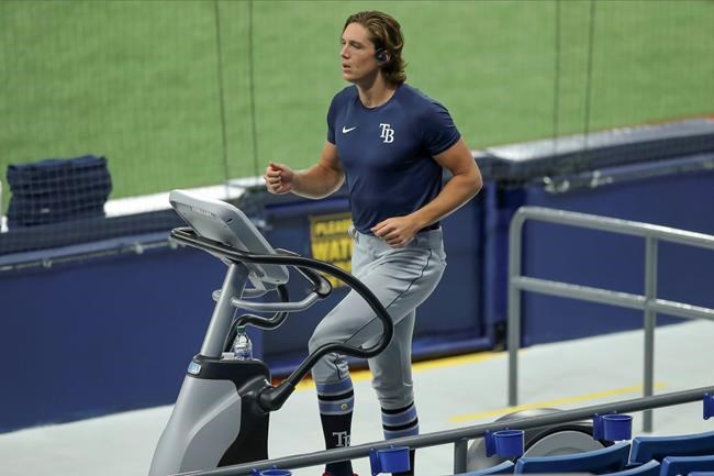 Tampa Bay Rays' Tyler Glasnow warms up during baseball practice, Tuesday, July 14, 2020, in St. Petersburg, Fla. (AP Photo/Mike Carlson)