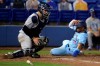 Toronto Blue Jays' Josh Palacios slides in to score next to New York Yankees catcher Gary Sanchez during the eighth inning of a baseball game Tuesday, April 13, 2021, in Dunedin, Fla. The Blue Jays won 7-3. (AP Photo/Mike Carlson)