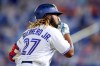 Toronto Blue Jays' Vladimir Guerrero Jr. gestures rounding third base after hitting his third home run against the Washington Nationals during the seventh inning of a baseball game Thursday, April 27, 2021, in Dunedin, Fla. (AP Photo/Mike Carlson)