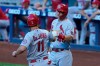St. Louis Cardinals' Paul DeJong (11) and Paul Goldschmidt (46) celebrate after scoring in the first inning of a baseball game against the Miami Marlins, Monday, April 5, 2021, in Miami. (AP Photo/Marta Lavandier)