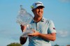 Matt Jones of Australia holds the trophy after winning the Honda Classic golf tournament, Sunday, March 21, 2021, in Palm Beach Gardens, Fla. (AP Photo/Marta Lavandier)