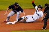 Miami Marlins' Corey Dickerson, right, is tagged out at second by Boston Red Sox third baseman Christian Arroyo, left, during the first inning of a baseball game, Tuesday, Sept. 15, 2020, in Miami. (AP Photo/Lynne Sladky)
