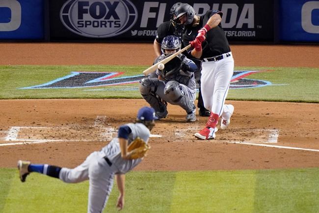 Miami Marlins' Jorge Alfaro hits a foul ball during the fifth inning of the team's baseball game against the Tampa Bay Rays, Saturday, Aug. 29, 2020, in Miami. (AP Photo/Wilfredo Lee)