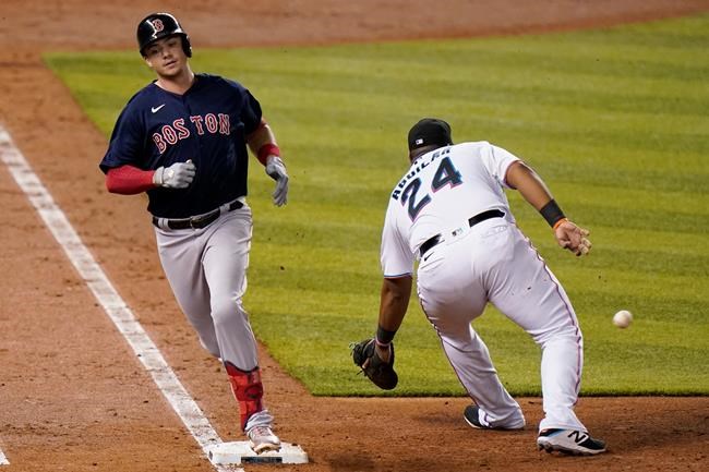 Boston Red Sox's Bobby Dalbec beats the throw to Miami Marlins first baseman Jesus Aguilar (24) for a singe during the fifth inning of a baseball game, Tuesday, Sept. 15, 2020, in Miami. (AP Photo/Lynne Sladky)