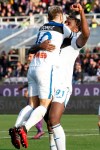 Atalanta's Duvan Zapata, right, is embraced by teammate Papo Gomez after scoring his side's first goal during the Italian Serie A soccer match between Fiorentina and Atalanta, at the Artemio Franchi stadium in Florence, Italy, Saturday, Feb. 8, 2020. (Marco Bucco/LaPresse via AP)