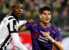 FILE - In a Friday Dec. 5 2014 file photo, Fiorentina's Mario Gómez and Juventu' Angelo Ogbonna hold each other during a Serie A soccer match at the Artemio Franchi stadium in Florence, Italy. Former Germany striker Mario Gómez has retired from soccer after scoring in his last game for Stuttgart. The soon-to-be 35-year-old says he has fulfilled his final wish – to help Stuttgart secure an immediate return to the Bundesliga after one season in the second division.(AP Photo/Fabrizio Giovannozzi, File)