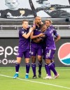 Orlando City's Tesho Akindele (17) celebrates his goal with teammates during an MLS soccer match against FC Cincinnati on Saturday, May 1, 2021, in Orlando, Fla. (Willie J. Allen Jr./Orlando Sentinel via AP)