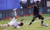 Philadelphia Union's Ilsinho, left, tumbles after a shove from Inter Miami's Andres Reyes during an MLS soccer match Tuesday, July 14, 2020, in Kissimmee, Fla. (Stephen M. Dowell/Orlando Sentinel via AP)