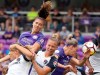 FILE - In this June 30, 2018, file photo, several players collide as Orlando Pride's Alex Morgan, top left, heads the ball toward the net during an NWSL soccer game against the North Carolina Courage at Orlando City Stadium in Orlando, Fla. The Pride have withdrawn from the upcoming National Women’s Soccer League tournament after six players and four staff members tested positive for COVID-19. The league says another round of testing will take place to confirm the results. (Stephen M. Dowell/Orlando Sentinel via AP, File)