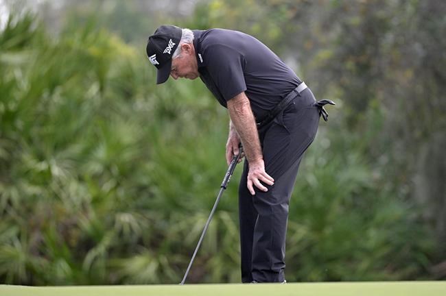 Gary Player, of South Africa, reacts after barely missing a putt on the third green during the final round of the PNC Championship golf tournament, Sunday, Dec. 20, 2020, in Orlando, Fla. (AP Photo/Phelan M. Ebenhack)