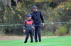 Tiger Woods, right, lines up a shot with his son Charlie on the 12th green during a practice round of the Father Son Challenge golf tournament, Thursday, Dec. 17, 2020, in Orlando, Fla. (AP Photo/Phelan M. Ebenhack)
