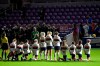 Some members of the United States team kneel during the playing of the national anthem before a SheBelieves Cup women's soccer match against Canada, Thursday, Feb. 18, 2021, in Orlando, Fla. (AP Photo/Phelan M. Ebenhack)