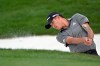 Collin Morikawa hits out of a bunker onto the 14th green during the final round of the Arnold Palmer Invitational golf tournament, Sunday, March 8, 2020, in Orlando, Fla. (AP Photo/Phelan M. Ebenhack)