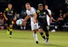 Minnesota United defender Chase Gasper (77) and Columbus Crew midfielder Luis Diaz (12) battle for the ball during the first half of an MLS soccer match in Kissimmee, Fla., Tuesday, July 28, 2020. (AP Photo/Reinhold Matay)