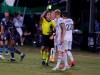 Referee Alex Cailowicz, center, issues a yellow card to Real Salt Lake defender Aaron Herrera (22) as defender Justen Glad (15) looks on during the first half of a soccer match against Minnesota United in Kissimmee, Fla., Friday, July 17, 2020. (AP Photo/Reinhold Matay)