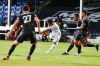 Los Angeles FC forward Latif Blessing (7) kicks the ball off the shoulder of Seattle Sounders defender Shane O'Neill (27) and in for a goal as Sounders forward Handwalla Bwana and midfielder Cristian Roldan, right, watch during the first half of an MLS soccer match in Kissimmee, Fla., Monday, July 27, 2020. (AP Photo/Reinhold Matay)