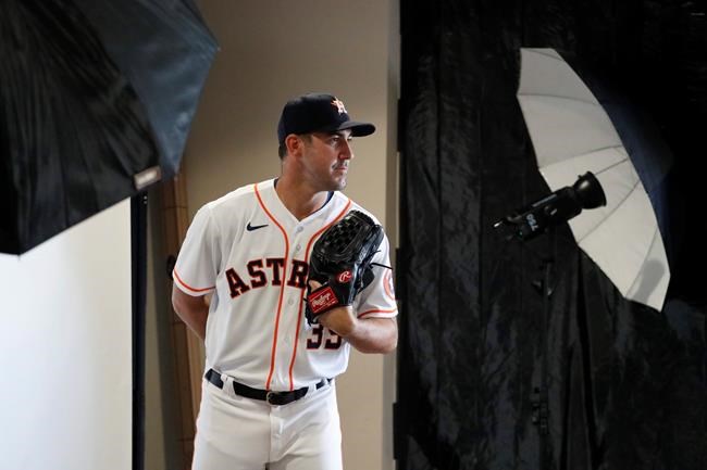 Houston Astros pitcher Justin Verlander poses for a photographer during photo day before a spring training baseball practice Tuesday, Feb. 18, 2020, in West Palm Beach, Fla. (AP Photo/Jeff Roberson)