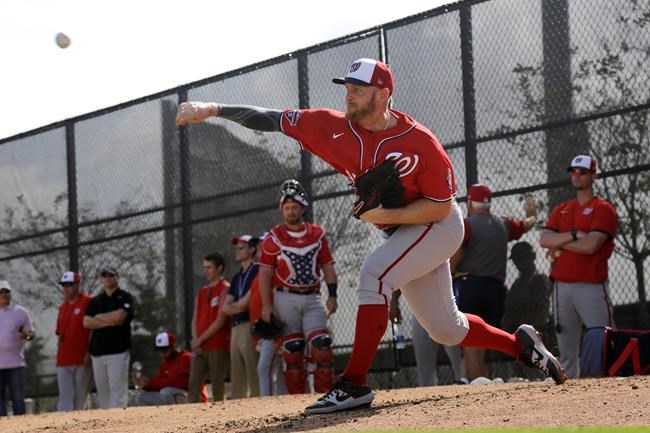Washington Nationals pitcher Stephen Strasburg throws a bullpen session during spring training baseball practice Friday, Feb. 14, 2020, in Jupiter, Fla. (AP Photo/Jeff Roberson)