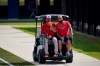 Washington Nationals pitching coach Jim Hickey, left, rides in the back of a golf cart with Nationals general manager Mike Rizzo during spring training baseball practice Thursday, Feb. 25, 2021, in West Palm Beach, Fla. (AP Photo/Jeff Roberson)