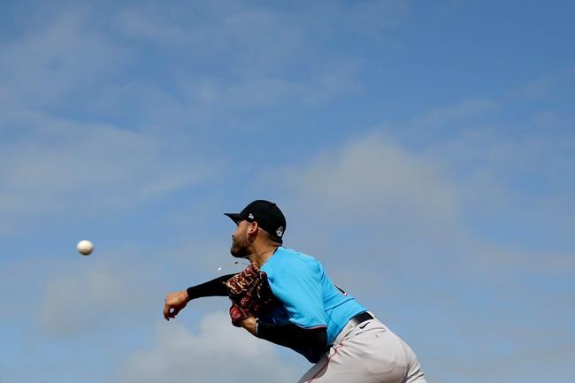 Miami Marlins pitcher Pablo Lopez throws a bullpen session during spring training baseball practice Sunday, Feb. 16, 2020, in Jupiter, Fla. (AP Photo/Jeff Roberson)