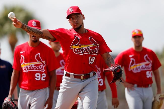St. Louis Cardinals pitcher Carlos Martinez throws during a spring training baseball drill Wednesday, Feb. 12, 2020, in Jupiter, Fla. (AP Photo/Jeff Roberson)