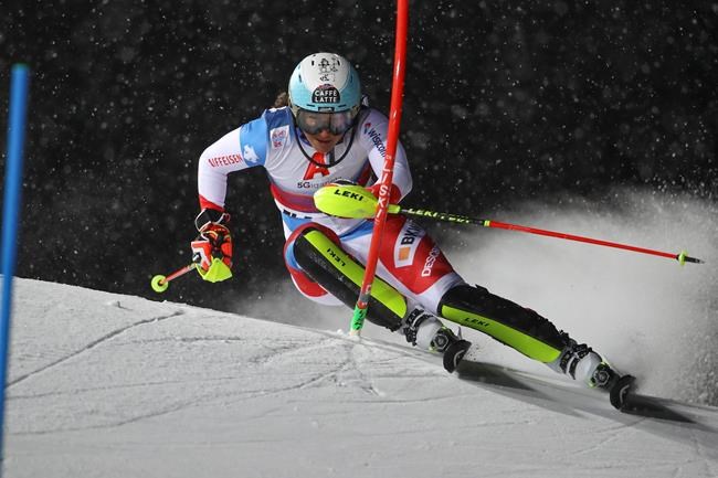 Switzerland's Wendy Holdener speeds down the course during an alpine ski, women's World Cup slalom in Flachau, Austria, Tuesday, Jan. 12, 2021. (AP Photo/Marco Trovati)