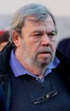 In this photo taken on Tuesday, Dec. 27, 2011, Gianni Mura attends the funerals of the Italian writer Giorgio Bocca at the San Vittore al Corpo church, in Milan, Italy. Gianni Mura, one of Italy’s most highly regarded sports journalists, has died. He was 74. La Repubblica, the national daily that Mura wrote for, said Mura died Saturday at a hospital in Senigallia after having a heart attack. Mura was known for his colorful soccer and Tour de France coverage. Until only recently, he still worked on a typewriter. (AP Photo/Luca Bruno)