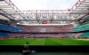 FILE - In this Sunday, March 8, 2020 filer, a view of the empty stadium during the Serie A soccer match between AC Milan and Genoa at the San Siro stadium, in Milan, Italy. While soccer leagues around Europe are still debating whether and when to resume playing, the leader of the continent’s Federation of Sports Medicine Associations is calling for a detailed series of tests to clear athletes for a return to training. Maurizio Casasco, who is also president of the Italian Federation of Sports Medicine, said that guidelines recently published by his domestic federation should be extended for all of Europe -- especially if UEFA intends to resume the Champions League and Europa League anytime soon. (AP Photo/Antonio Calanni, File)