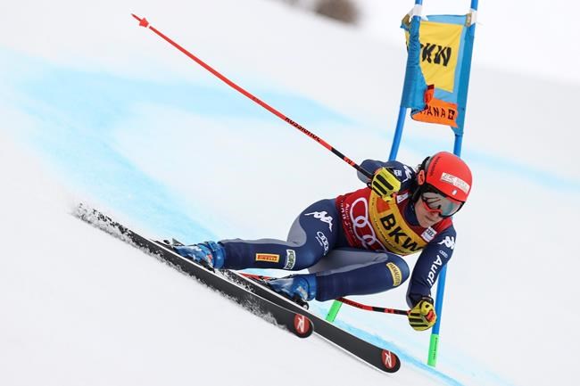 Italy's Federica Brignone speeds down the course during the super-G portion of an alpine ski, women's World Cup alpine combined, in Crans Montana, Switzerland, Sunday, Feb. 23, 2020. (AP Photo/Alessandro Trovati)