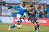 FILE - In this Sunday, Feb. 9, 2020 filer, Udinese's Rodrigo De Paul, right, and Brescia's Mario Balotelli vie for the ball, during a Italian Serie A soccer match at the Mario Rigamonti stadium in Brescia, Italy. Former Italy striker Mario Balotelli was reportedly fired by his hometown club for failing to report for training as the Italian soccer season prepares to resume from a three-month break due to the coronavirus pandemic. (Gianluca Checchi/LaPresse via AP, File )