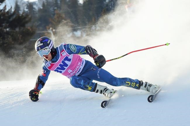 United States' Tommy Ford speeds down the course during an alpine ski, men's World Cup Giant slalom, in Adelboden, Switzerland, Saturday, Jan. 9, 2021. (AP Photo/Marco Tacca)
